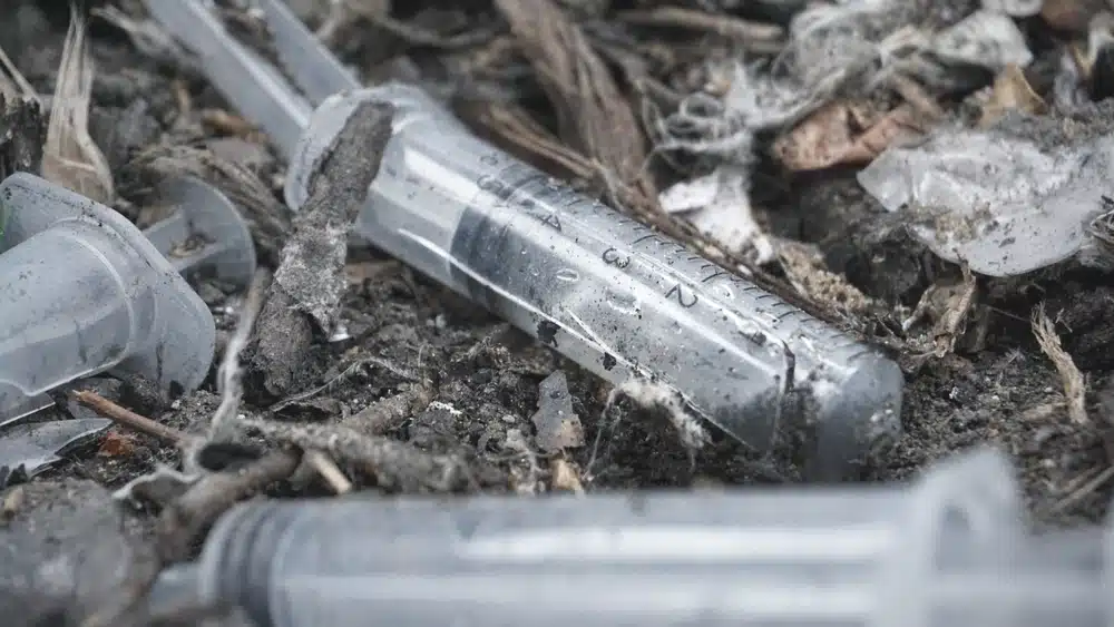 Syringes lying in an abandoned house.